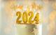 A celebration cake with 2024 candles on top